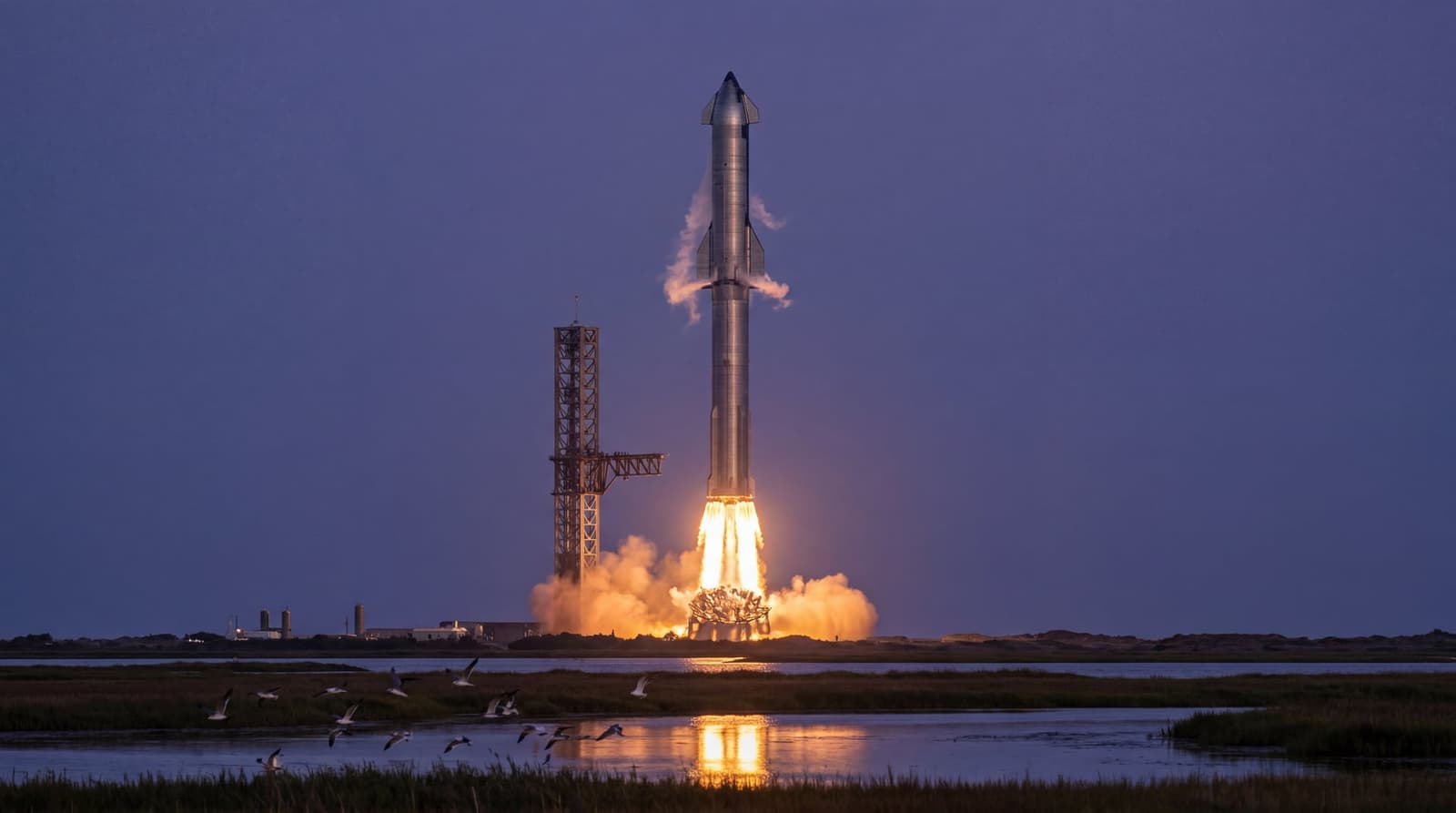 A towering stainless-steel Starship rocket lifting off at dusk from a coastal Texas launch pad, twin plumes of orange flame, distant gantry tower silhouetted against a violet sky